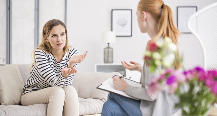 Two ladies having a conversation, one health coach and one client